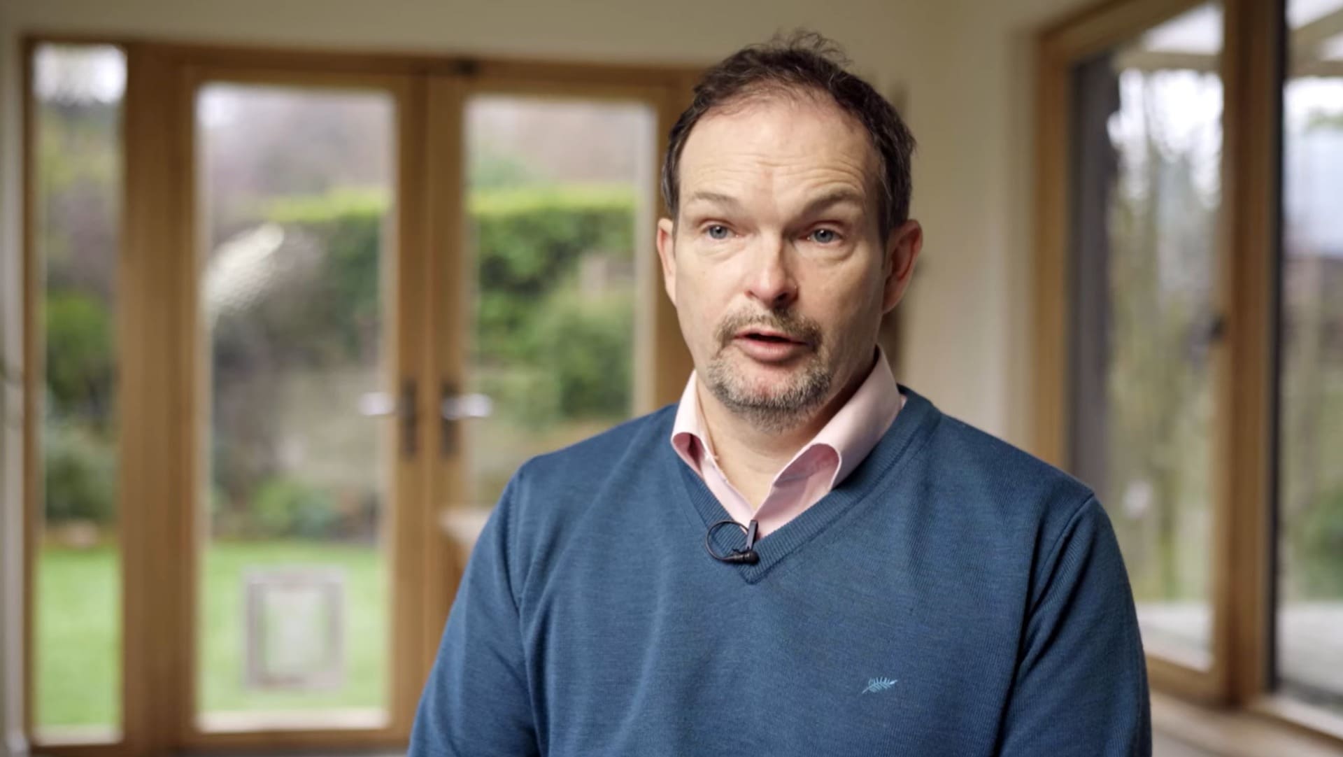 Solar Installation Dublin Case Study image showing Cyril, an Ohk energy customer, in his home in Dublin.