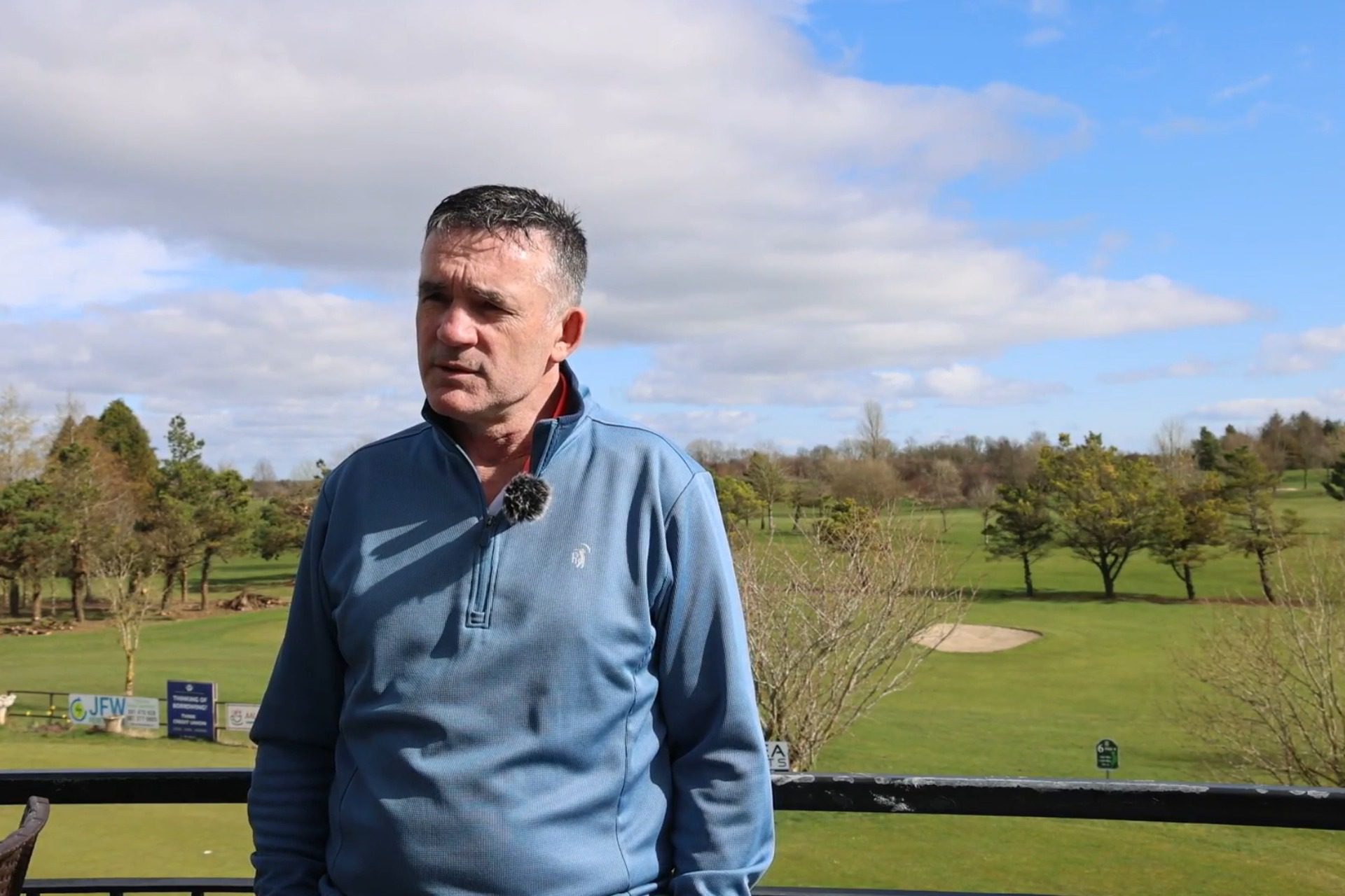 Golf Club Solar Panel Installation Featured Image showing Loughrea Golf Club representative, Adrian Callanan, in foreground with golf course behind.
