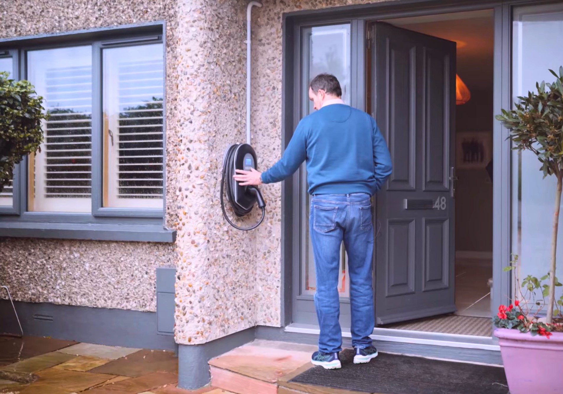 Home EV Charger Image showing a zappi EV Charger installed at the front of an Ohk energy customer's home.