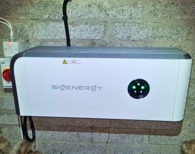 Solar Inverter Installed In Limerick Image showing a Sigenergy hybrid inverter and isolators installed on a wall in a secluded area in a Limerick home.