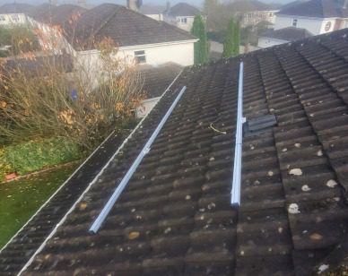 Solar Panels Being Installed In Limerick Image showing solar panel rails on a roof in Limerick.