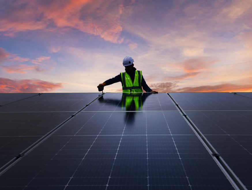 Ohk energy electrician installing solar panels on a roof.