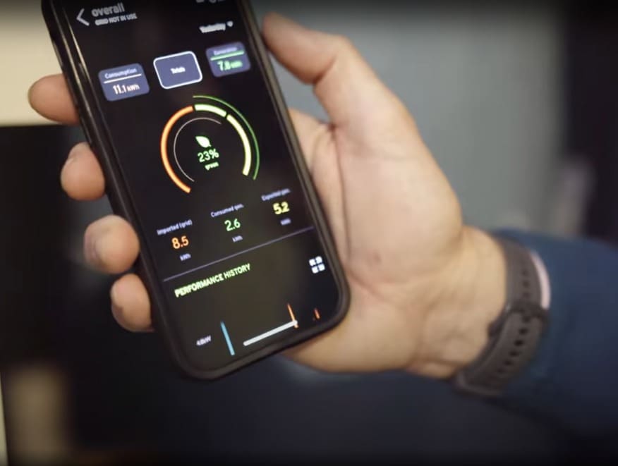 Solar Installation Dublin Results Image which is a close-up picture of a hand showing solar power generation results on a smartphone.