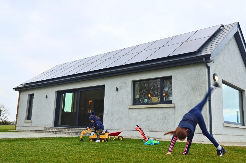 Home Retrofit Example Image showing children outside a home that was retrofitted by Ohk energy.