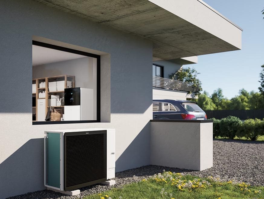 Air To Water Heat Pump Installation Image showing a home with a heat pump installed.