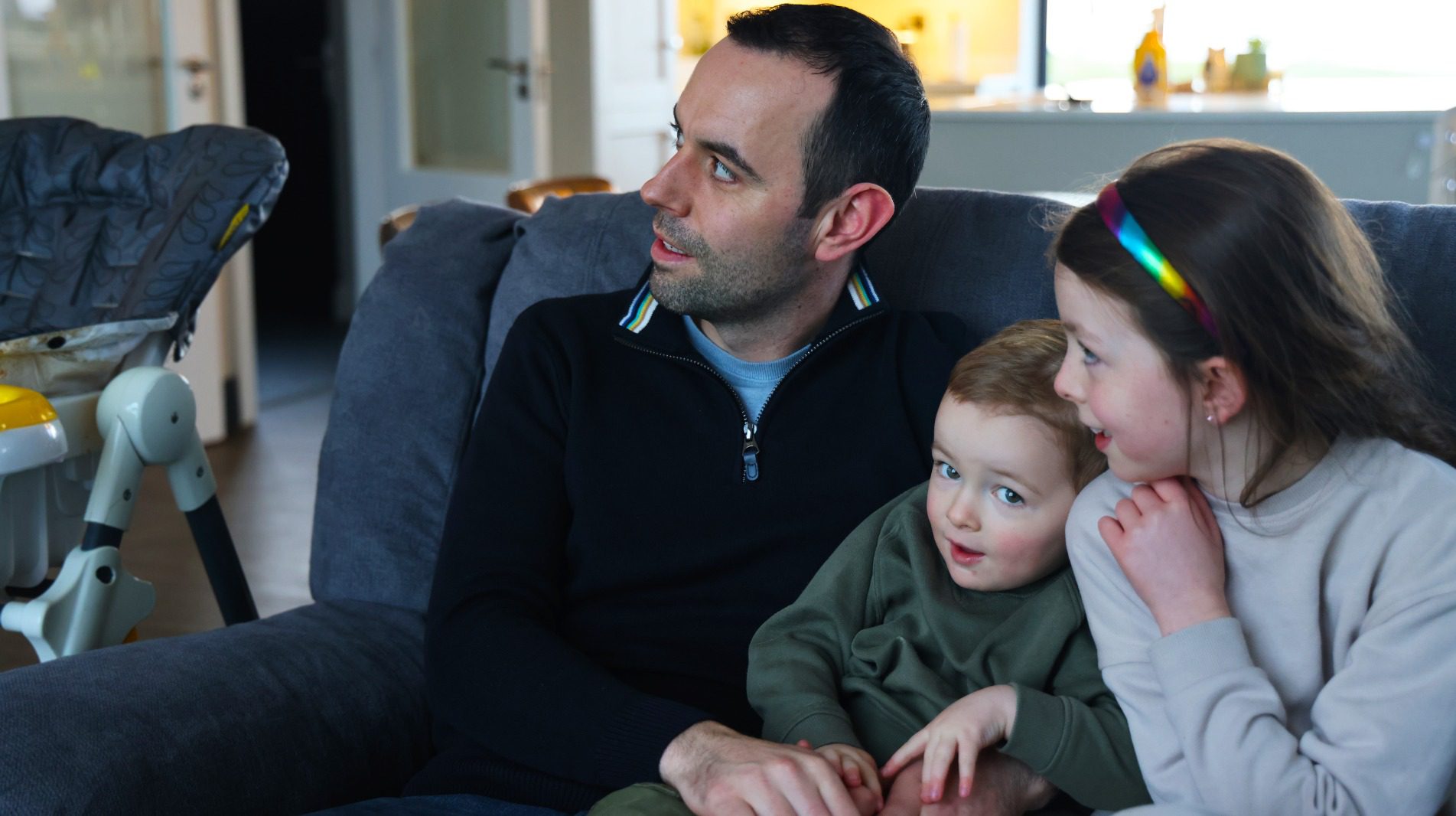 Image of a family in their comfortable home.