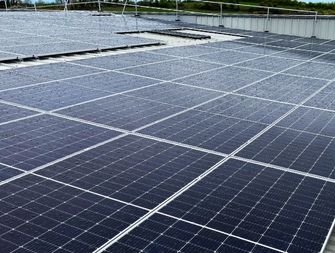 Industrial roof-top solar panel installation.