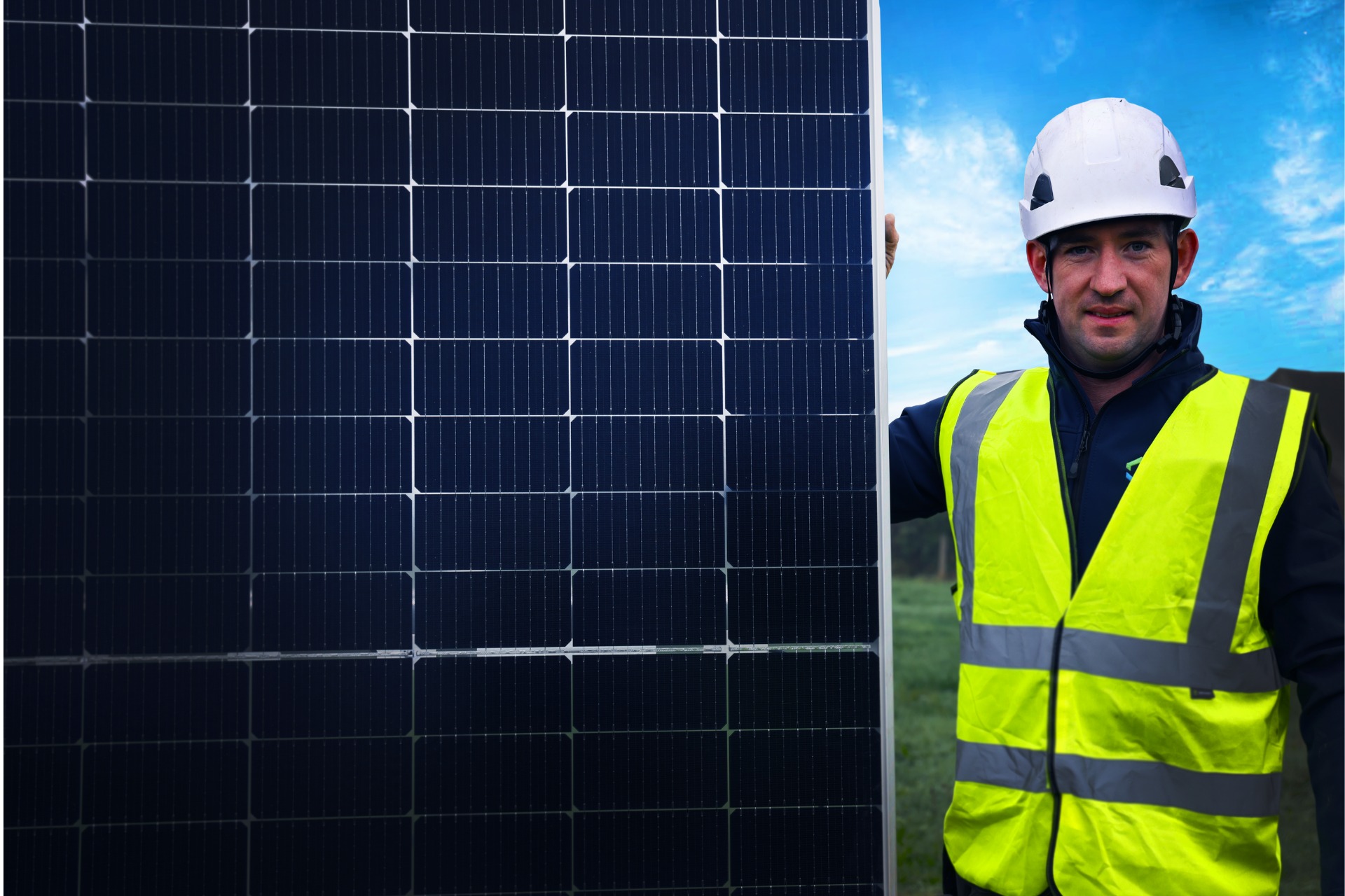 Solar PV Panels featured image showing an Ohk energy electricity standing beside a PV panel.