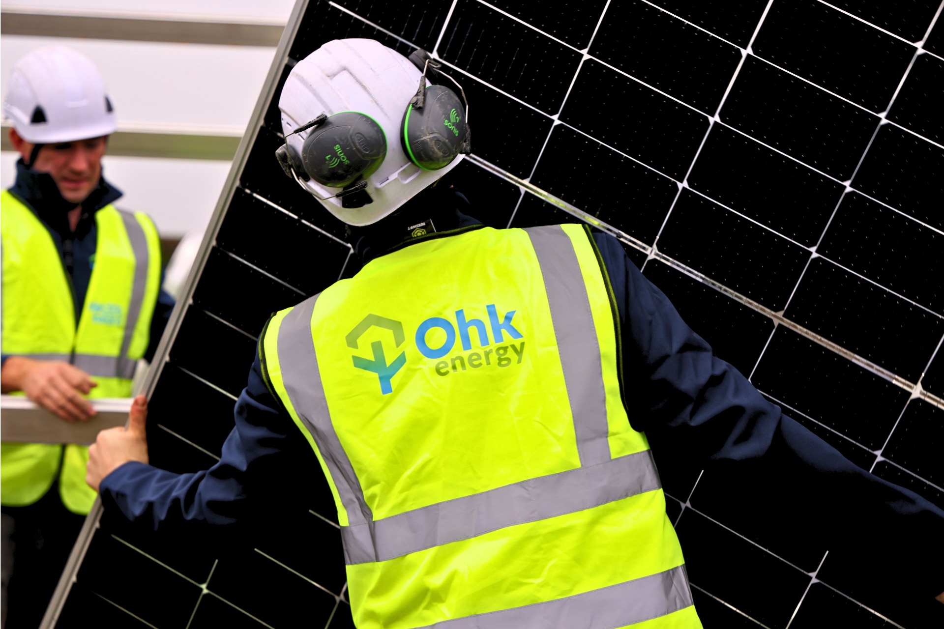 Solar Panels In Limerick Image showing 2 Ohk energy electricians installing solar panels.