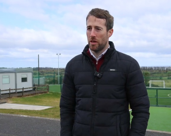 Solar Panels for Schools Video Preview image of Gary Winters, Principal of Kilnadeema National School, talking to Ohk energy outside of his school.