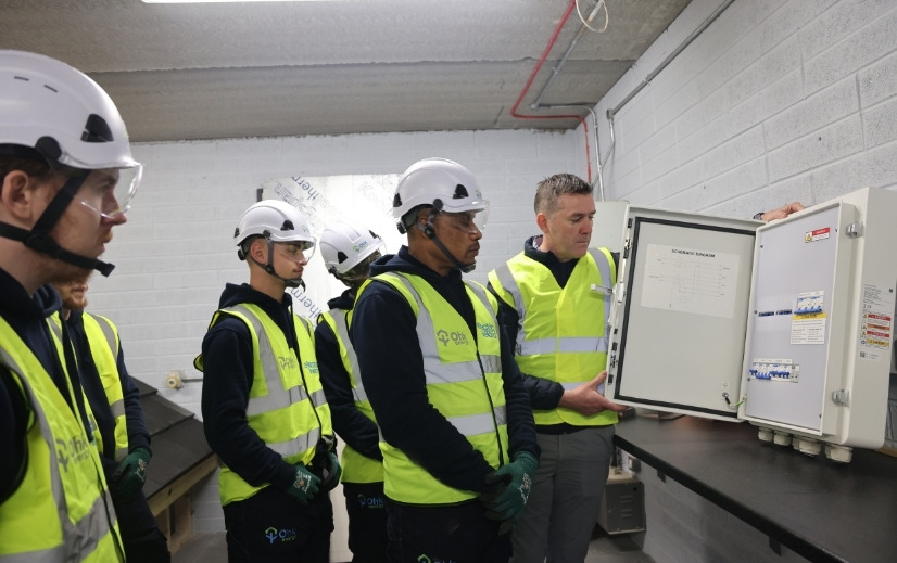 Renewable Construction Technologies Traineeship Solar Installation Training image showing Ohk energy teaching students about distribution board requirements for solar.
