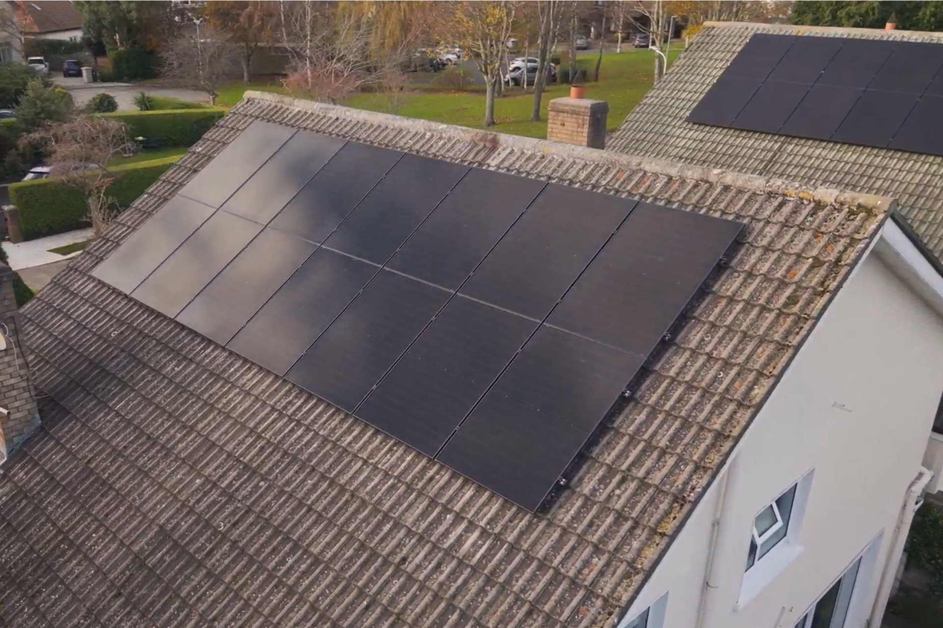 Solar Panel Installation Complete image of 14 solar panels (installed by Ohk energy) on a roof.